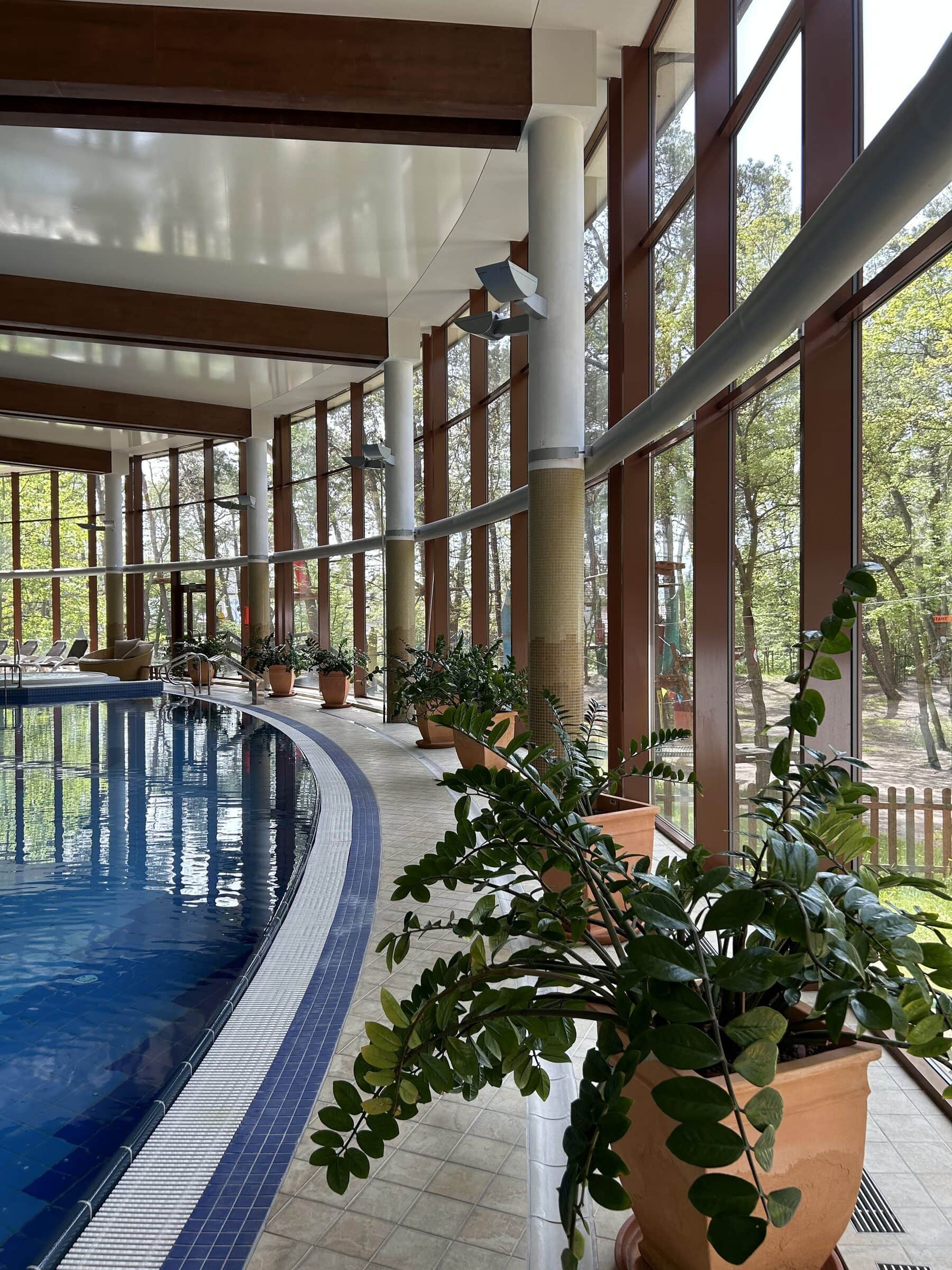 Pool hall at Hotel Dom Zdrojowy with lush greenery
